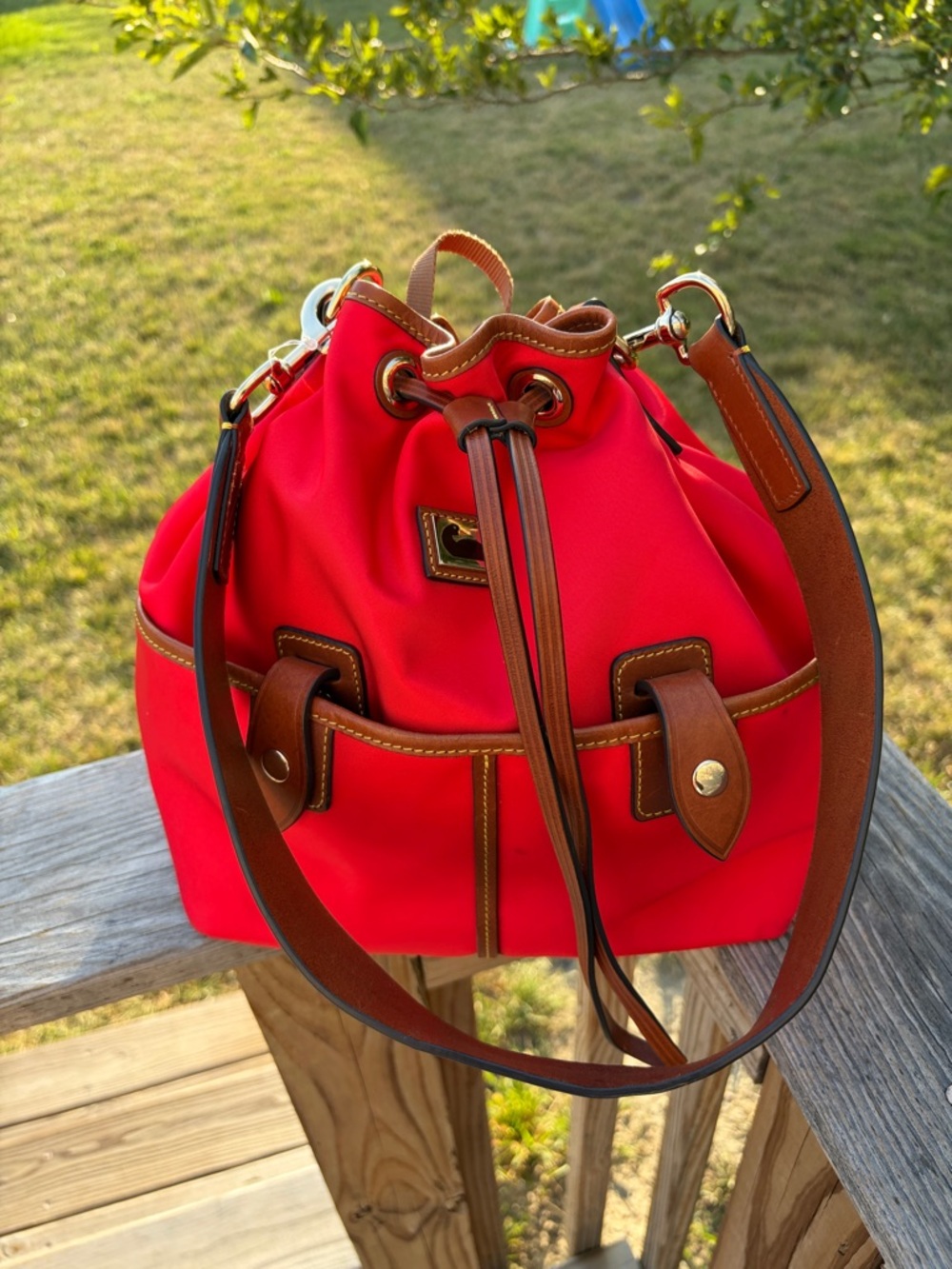 Dooney & Bourke Wayfarer drawstring Red Bucket shoulder bag with tan leather